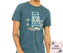 Load image into Gallery viewer, Caution slippery when reading T-shirt
